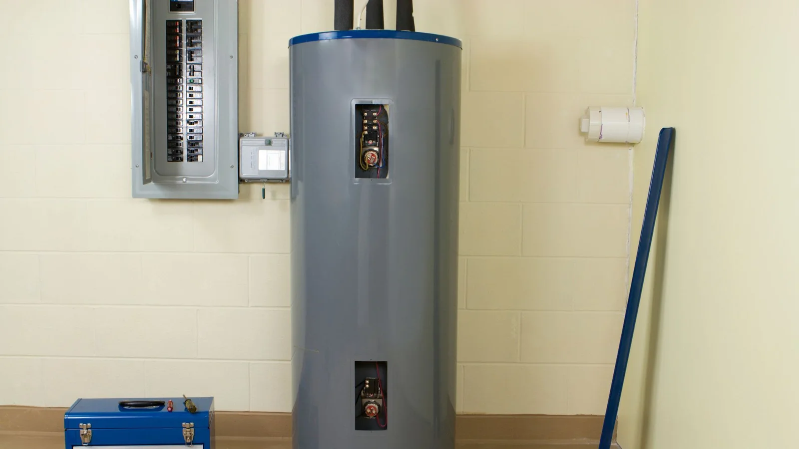 Professional plumber performing water heater repair in Ventura County home