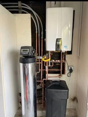 Water softener and tankless water heater with copper piping installation