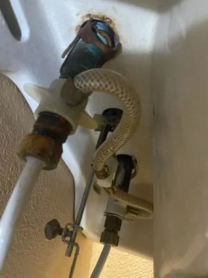 PVC drain and supply lines with shut-off valves installed on bathroom wall studs