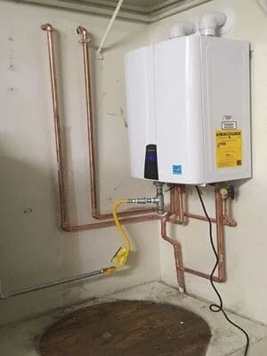 Tankless water heater with copper piping and safety valve installation